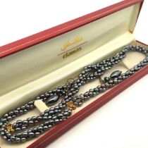 A boxed Damas rope twist pearl necklace and bracelet set with matching earrings (not pearl).