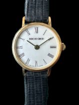 A Bueche Girod Swiss-made 9ct gold ladies wristwatch, white dial with Roman numerals and black strap