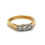 A hallmarked yellow 18ct gold and three stone diamond ring, size I. Diamond weight approx 0.3ct.