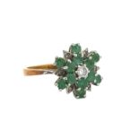 An 18ct gold emerald and diamond flower ring. Size K. Total weight 3.67g. 1977 London hallmarks.
