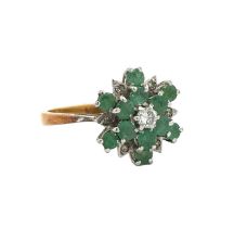 An 18ct gold emerald and diamond flower ring. Size K. Total weight 3.67g. 1977 London hallmarks.