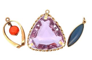 A 9ct gold purple paste triangular pendant, a 9ct marquise shaped purple jade pendant and a yellow