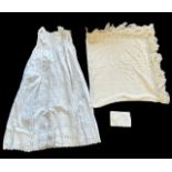 Victorian embroidered shawl and Christening gown, in small brown suitcase.