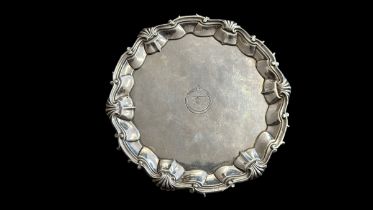 18th Century silver serving plate on three feet. HB makers mark with London hallmark. Engraved