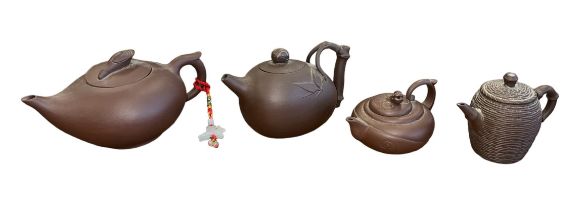 Four Oriental Terracotta Teapots with varying designs & sizes, to include; bamboo handle, thatched