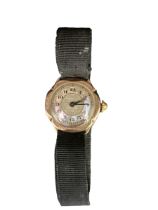 A 9ct gold watch with a flower-shaped mother of pearl dial and black ribbon strap. Total weight 9.
