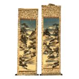 Pair of Japanese hand decorated hanging scrolls, each with a vertical landscape design featuring a