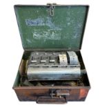 Automaticket Ltd London bus ticket machine, housed in tin with partially attached leather strap. ‘