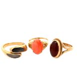 Three gem set gold rings, sizes P-Q. A 14ct agate ring, 3.4g. A 9ct carnelian ring and a 9ct abalone