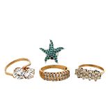 Three 9ct gold paste/ CZ rings and a starfish white metal and CZ pin brooch. Total weight of rings