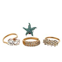 Three 9ct gold paste/ CZ rings and a starfish white metal and CZ pin brooch. Total weight of rings