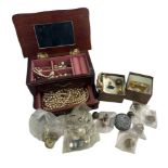 A wooden jewellery box containing several imitation pearls pieces of jewellery, necklaces,