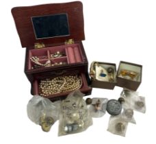 A wooden jewellery box containing several imitation pearls pieces of jewellery, necklaces,
