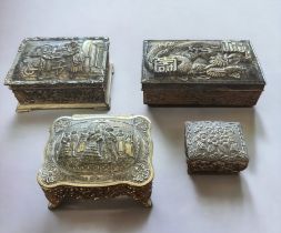 Four white metal trinket boxes with embossed decoration. Some of the hinges are in need repair -