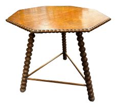 A late 19th century Gipsy table, the octagonal top with beaded edge over the bobbin turned