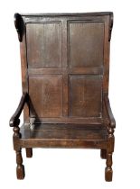 18th Century English oak settle, circa 1725 made from a wall panel, later seat lid. Width 94cm,