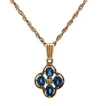 A quatrefoil sapphire and diamond pendant necklace. Pendant and chain hallmarked 9ct. Length of