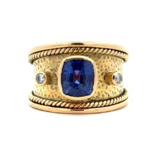 A sapphire ring and diamond ring. A natural cushion cut sapphire approx 8mm x 7mm is set in unmarked