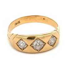 A gypsy ring set with three old mine cut diamonds, size M. Stamped 18ct. Central diamond approx 0.