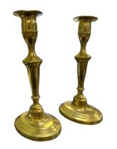 Pair of Brass candlesticks marked ‘G.MD’ to underside of base. Height 23cm. (2)