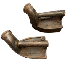 A pair of antique coal irons marked "Baweja 10" (2)