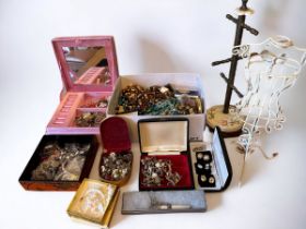 A large amount of costume jewellery, a jewellery stand and wire dress display stand. Please see