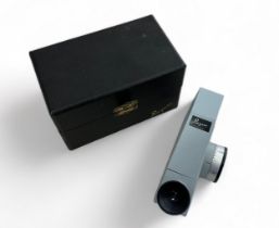 A Rayner Dialdex refractometer in a fitted case with a polarising filter and bottle of 1.79