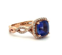 Tanzanite and diamond rose gold ring, stamped BH 14K, size N. The cushion cut tanzanite, 8.13 x 8.08