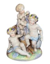 19th / 20th Century Allegorical Porcelain figural Putti group, toasting glasses and sat on a tree