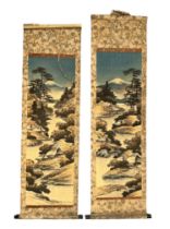 Pair of Japanese hand decorated hanging scrolls, each with a vertical landscape design featuring a