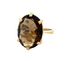 A smoky quartz set in 18ct gold, size L. Smoky quartz 16mm x 12mm. Weight 5.02g. Please see the