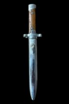 Second World War, short bayonet with scabbard. Brown handle, top of handle marked L 77765. Blade