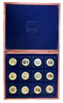 Churchill set of 12 pictorial gold plated medallions, in wooden presentation case.