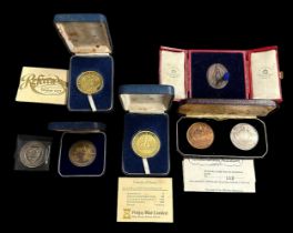 Collection of commemorative medals with cased Cunard Queen Elizabeth final voyage silver and