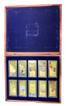 Battles of World War II set of 10 pictorial gold plated ingots, in a wooden presentation case.