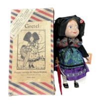 1917 onwards JP Gallais & Cie (Hansi) Gretel doll including umbrella and Hansi swing ticket,
