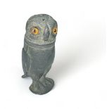 A late 19th / early 20th Century pewter novelty pepperette in the form of an owl, with glass eyes.