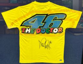 Framed signed Valentino Rossi shirt. Rossi's famous '46 The Doctor' yellow t-shirt. COA label from