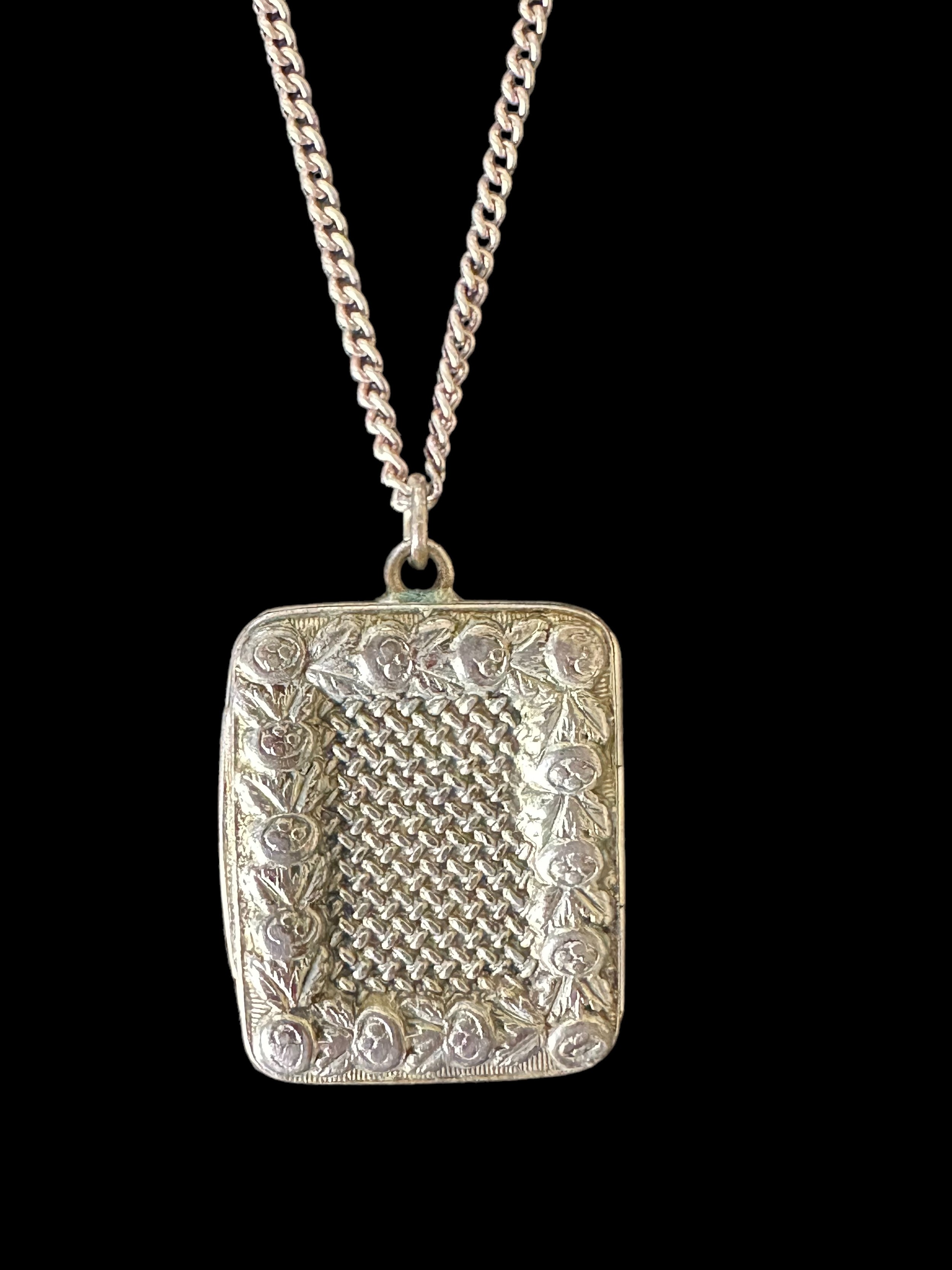 A silver vinaigrette pendant with gilt interior. Marked M.E.H. in the interior. Hallmarks rubbed and