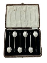 A cased set of six silver coffee spoons with ebonised coffee beans to handles by William Suckling