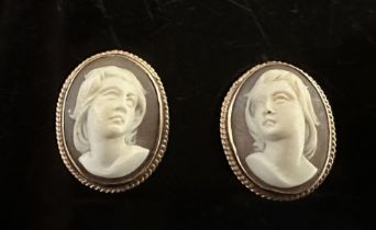 A pair of shell cameo earrings with rope twist surround. Stamped 9ct. Length 2cm. Weight 8.85g.