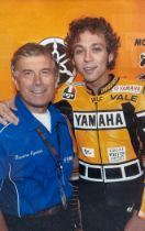 Framed signed Giacomo Agostini picture, pictured with Valentino Rossi. Giacomo amassed 122 Grand