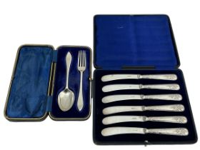 A silver fork and spoon set by William Hutton & Sons Ltd , Sheffield 1904. Together with a cased set