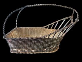 A silver plated bottle holder in the form of a woven basket, by Israel Freeman & Son. Probably circa