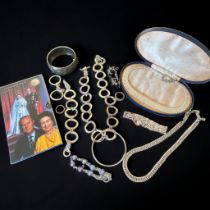 A selection of silver and white metal jewellery. Includes a gate link bracelet, a silver and