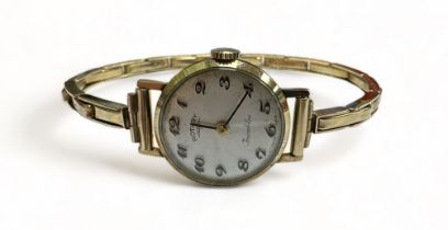 Rotary Incabloc 9ct Gold ladies wristwatch, silvered dial with arabic numerals. Thin extending wrist