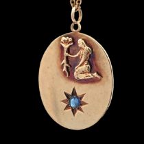 A 9ct gold oval zodiac pendant with raised Virgo symbol ans sapphire in star beneath. Stamped .