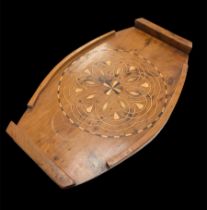 Inlaid wooden serving tray with geometric central pattern. Likely Islamic in origin. Handles to