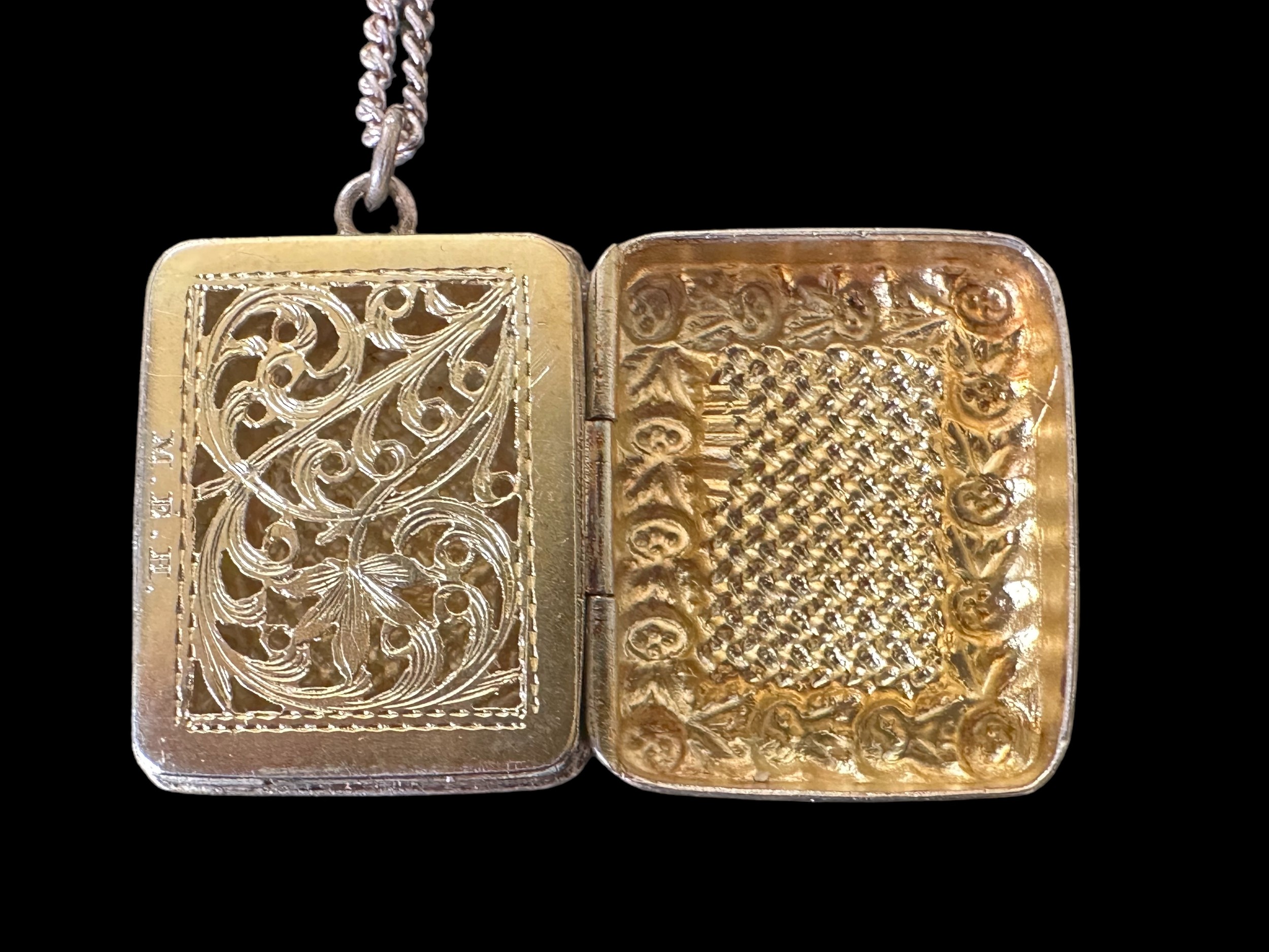 A silver vinaigrette pendant with gilt interior. Marked M.E.H. in the interior. Hallmarks rubbed and - Image 2 of 2