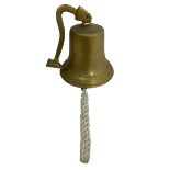 An unmarked brass ship's bell with bracket. Height 20cm.